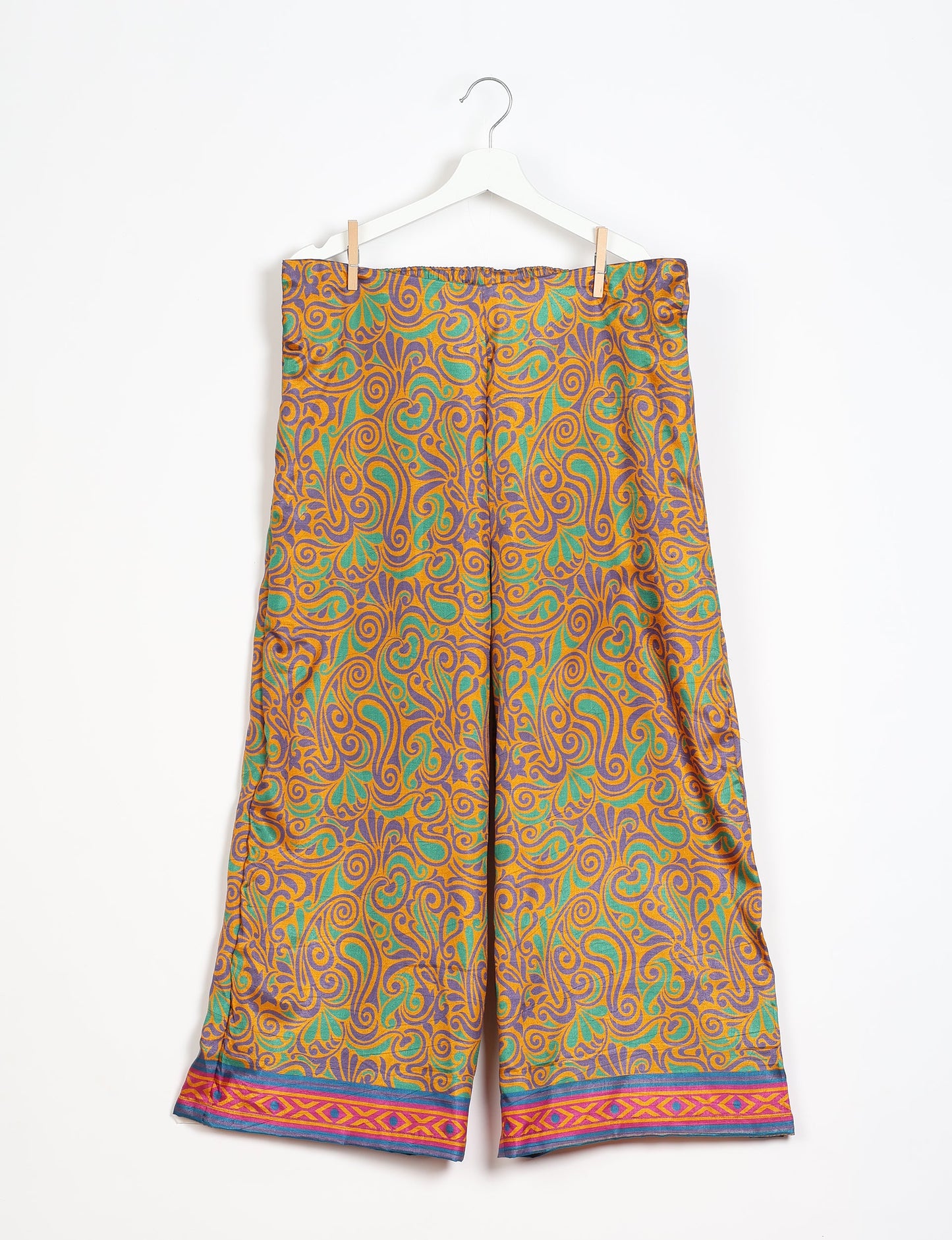 Step into sustainable fashion with our Palazzo Pants – a harmonious blend of Indian and Italian influences. These wide-legged pants, made from upcycled saris, offer comfort with an all-around elastic waist and a stylish flared leg. Make a statement with eco-friendly, chic palazzo pants that redefine ethical clothing.