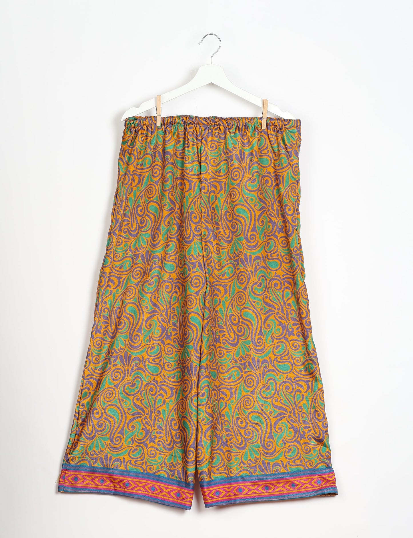 Step into sustainable fashion with our Palazzo Pants – a harmonious blend of Indian and Italian influences. These wide-legged pants, made from upcycled saris, offer comfort with an all-around elastic waist and a stylish flared leg. Make a statement with eco-friendly, chic palazzo pants that redefine ethical clothing.