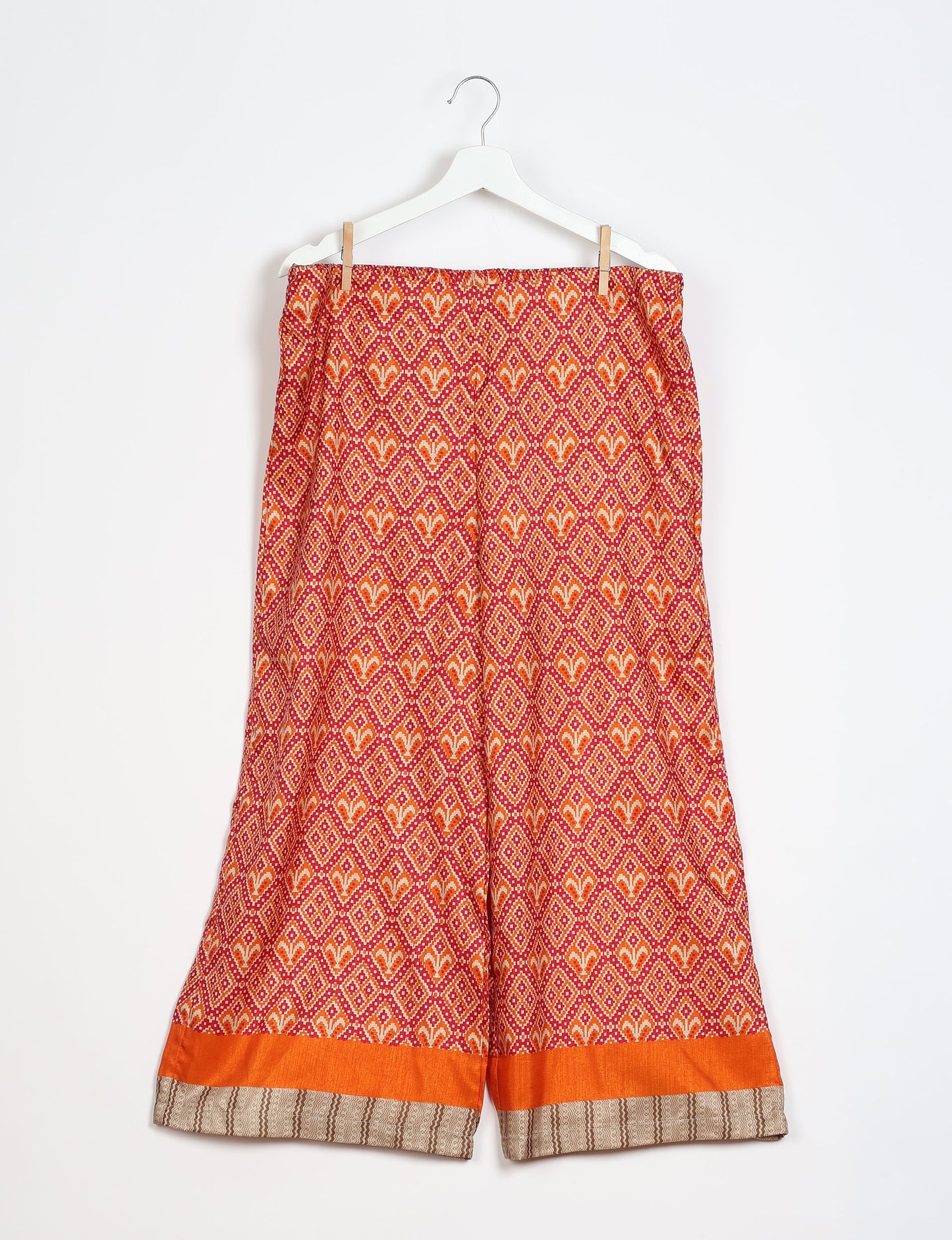 Step into sustainable fashion with our Palazzo Pants – a harmonious blend of Indian and Italian influences. These wide-legged pants, made from upcycled saris, offer comfort with an all-around elastic waist and a stylish flared leg. Make a statement with eco-friendly, chic palazzo pants that redefine ethical clothing.