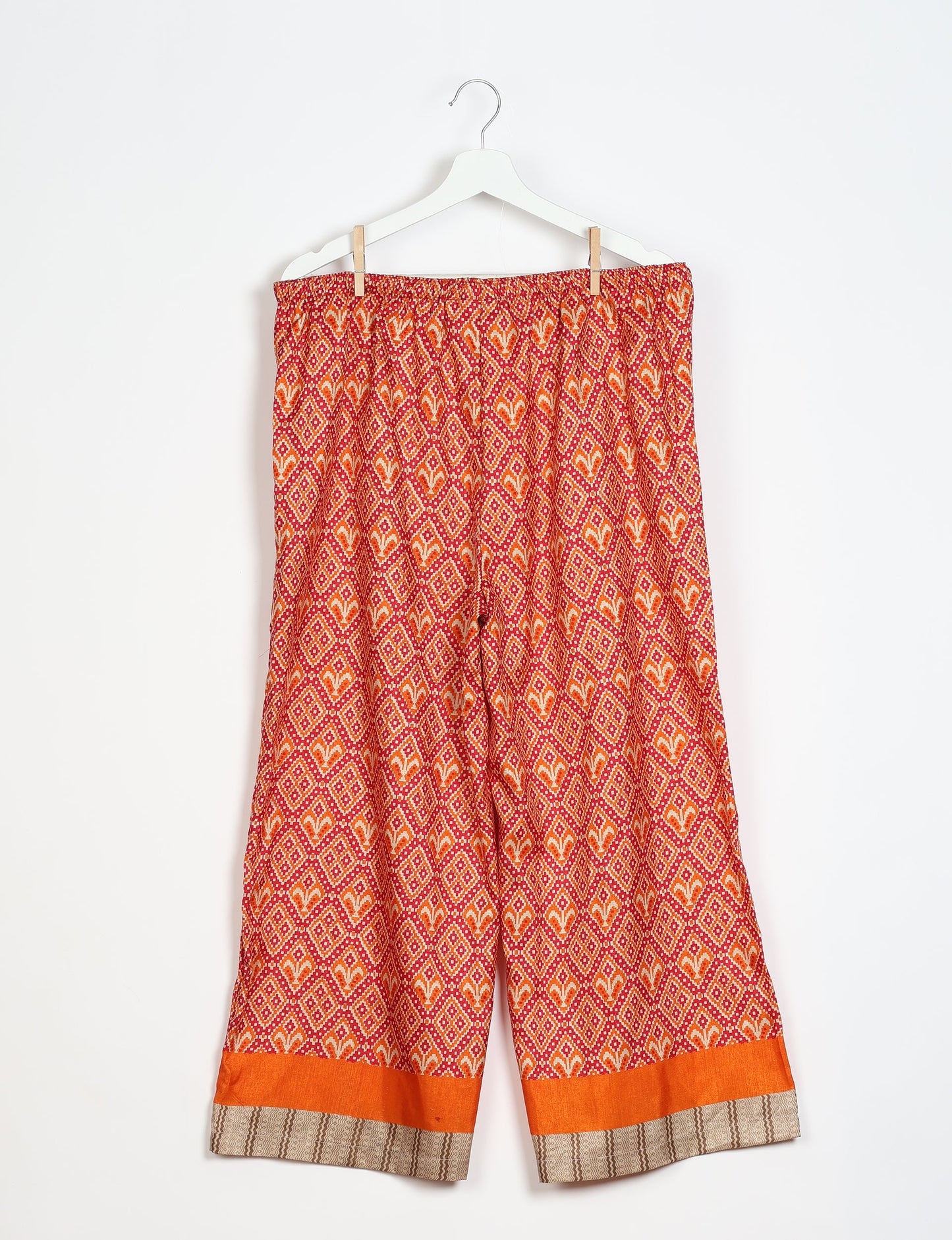 Step into sustainable fashion with our Palazzo Pants – a harmonious blend of Indian and Italian influences. These wide-legged pants, made from upcycled saris, offer comfort with an all-around elastic waist and a stylish flared leg. Make a statement with eco-friendly, chic palazzo pants that redefine ethical clothing.