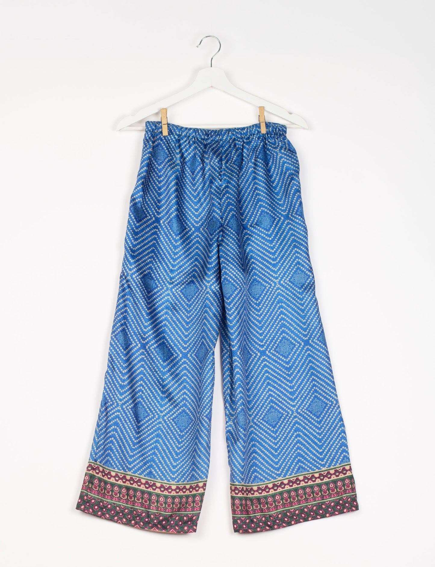 Step into sustainable fashion with our Palazzo Pants – a harmonious blend of Indian and Italian influences. These wide-legged pants, made from upcycled saris, offer comfort with an all-around elastic waist and a stylish flared leg. Make a statement with eco-friendly, chic palazzo pants that redefine ethical clothing.