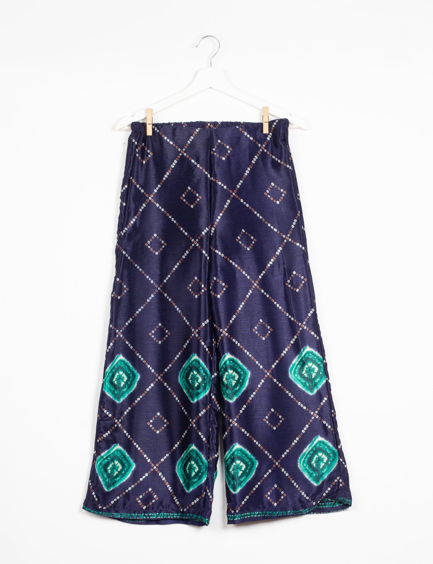 Step into sustainable fashion with our Palazzo Pants – a harmonious blend of Indian and Italian influences. These wide-legged pants, made from upcycled saris, offer comfort with an all-around elastic waist and a stylish flared leg. Make a statement with eco-friendly, chic palazzo pants that redefine ethical clothing.