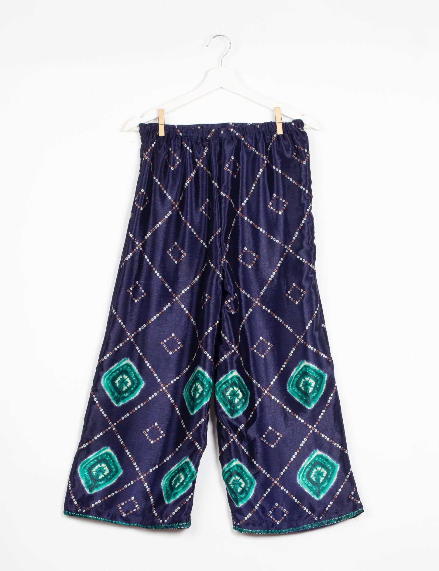 Step into sustainable fashion with our Palazzo Pants – a harmonious blend of Indian and Italian influences. These wide-legged pants, made from upcycled saris, offer comfort with an all-around elastic waist and a stylish flared leg. Make a statement with eco-friendly, chic palazzo pants that redefine ethical clothing.