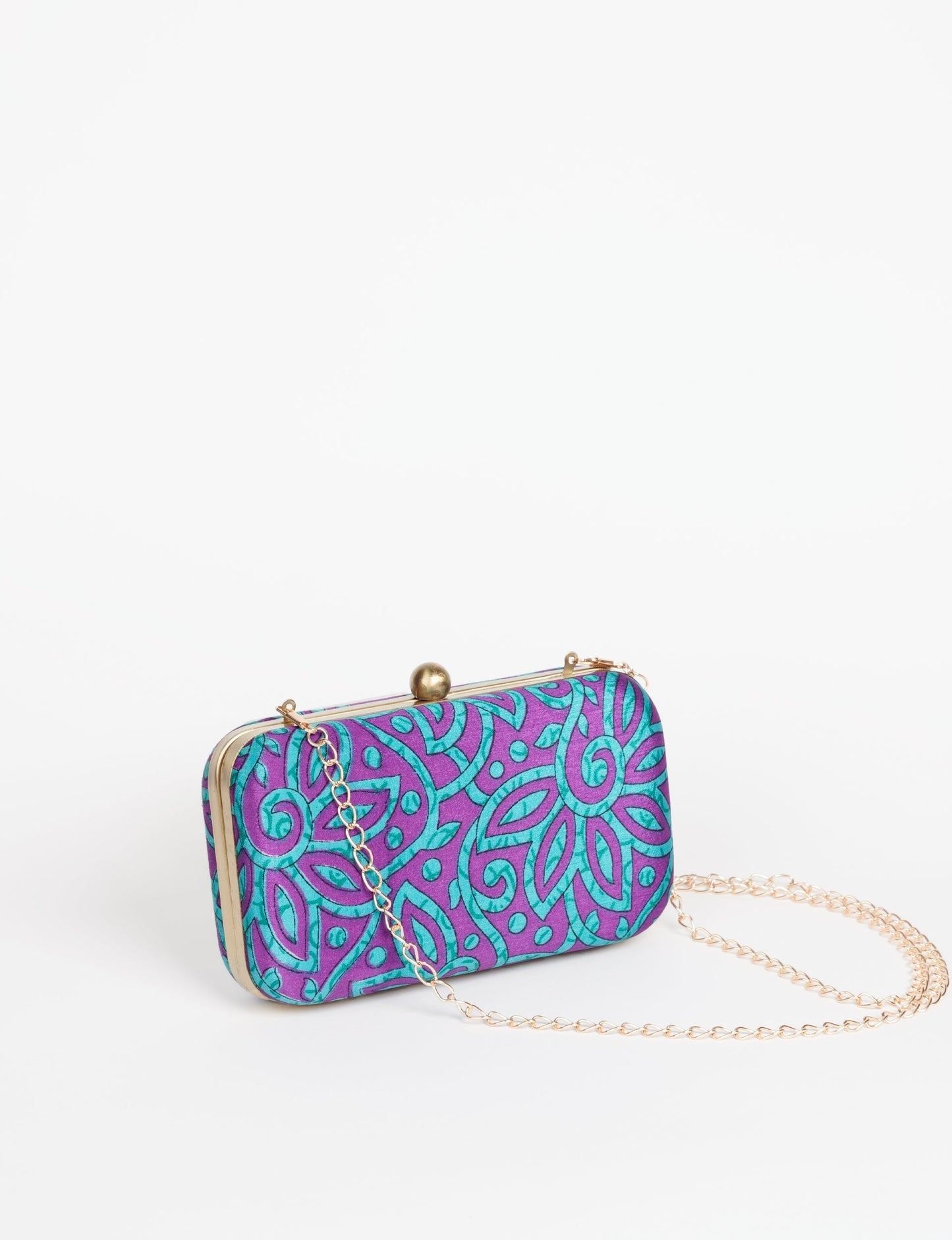 Stylish CLUTCH HANDBAG, a perfect companion for your evening look. Firm rectangular frame, optional metallic sling, and stunning prints add color to your outfit. Eco-friendly and ethically crafted for sustainable fashion.