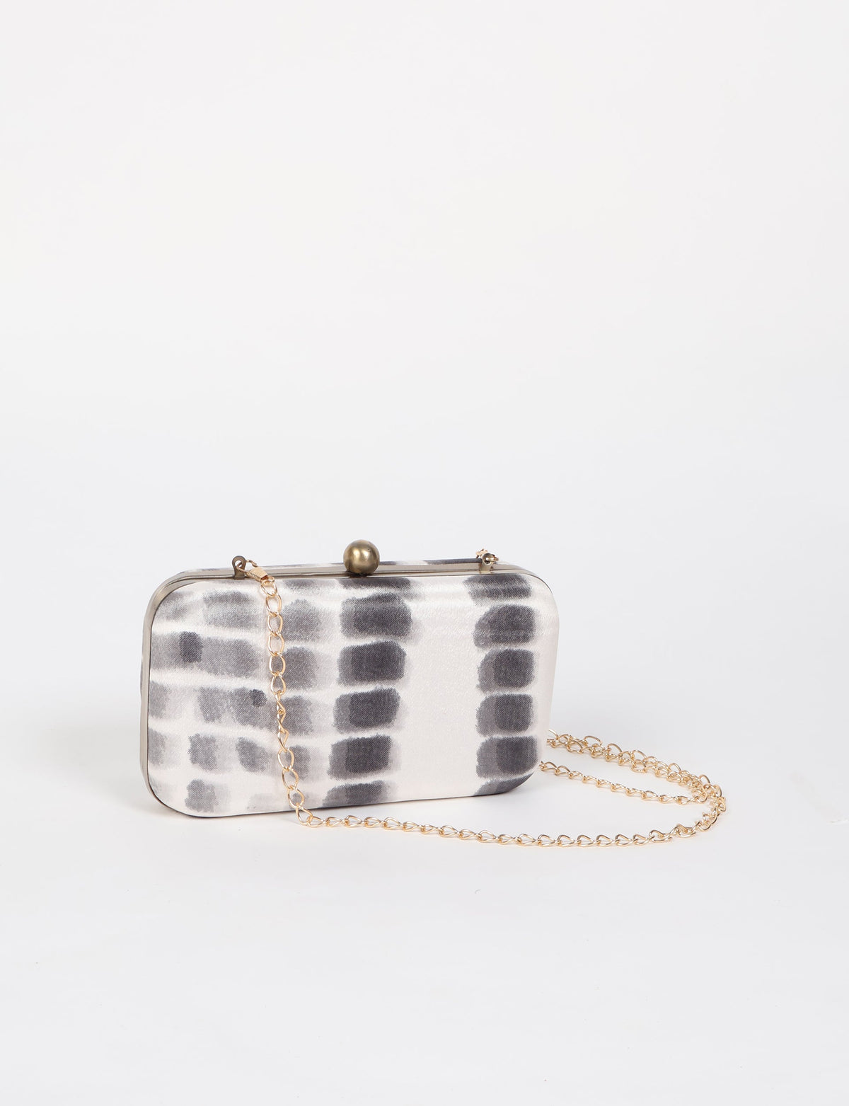 Rectangular clutch handbag with white and gray abstract pattern, gold-tone frame, clasp, and chain strap, front view