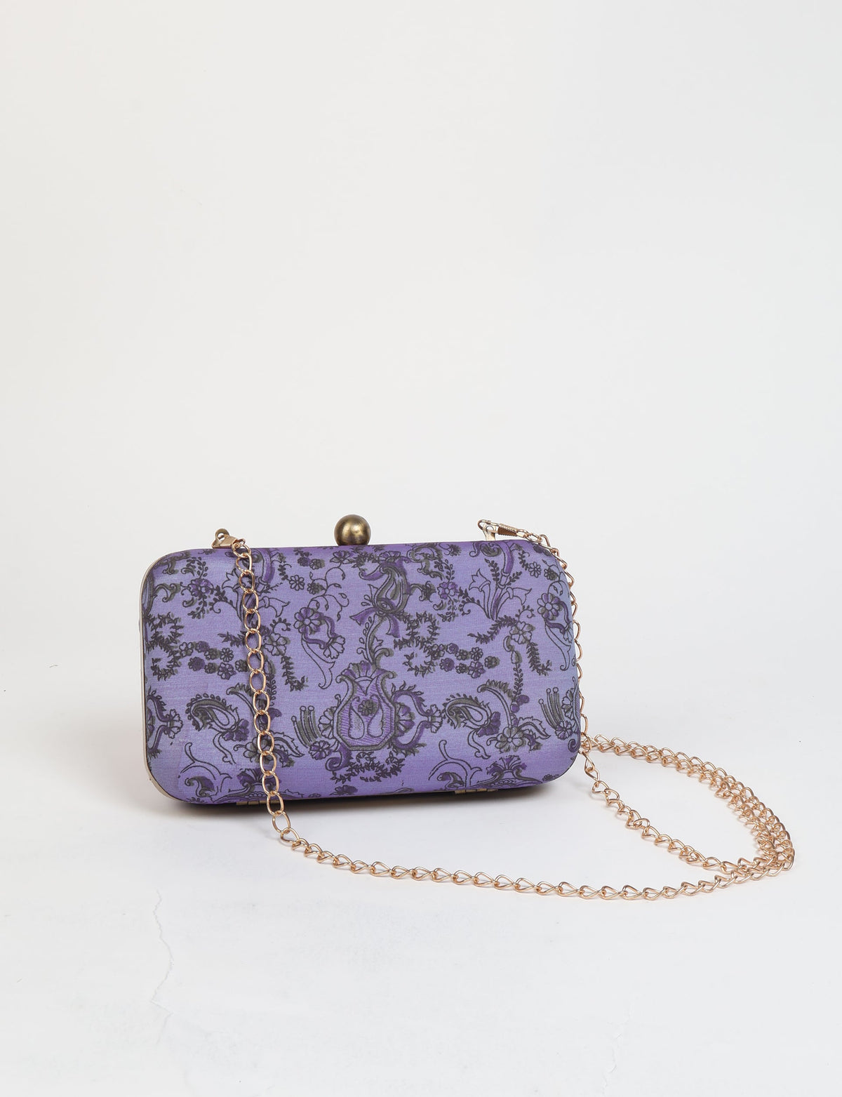Purple clutch handbag with black tropical floral pattern and gold chain strap, front view on white background
