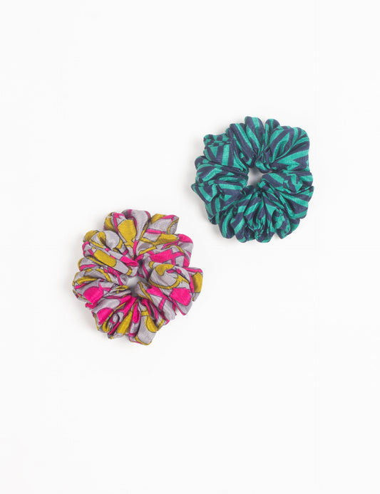 Upgrade your hairstyle with our Scrunchy Set of 2 – elastic hair ties wrapped in colorful Indian sari fabric. A top pick in ethical and green fashion, these eco-friendly prints add flair to your wrist and hair, making a sustainable style statement that catches attention and sparks change.