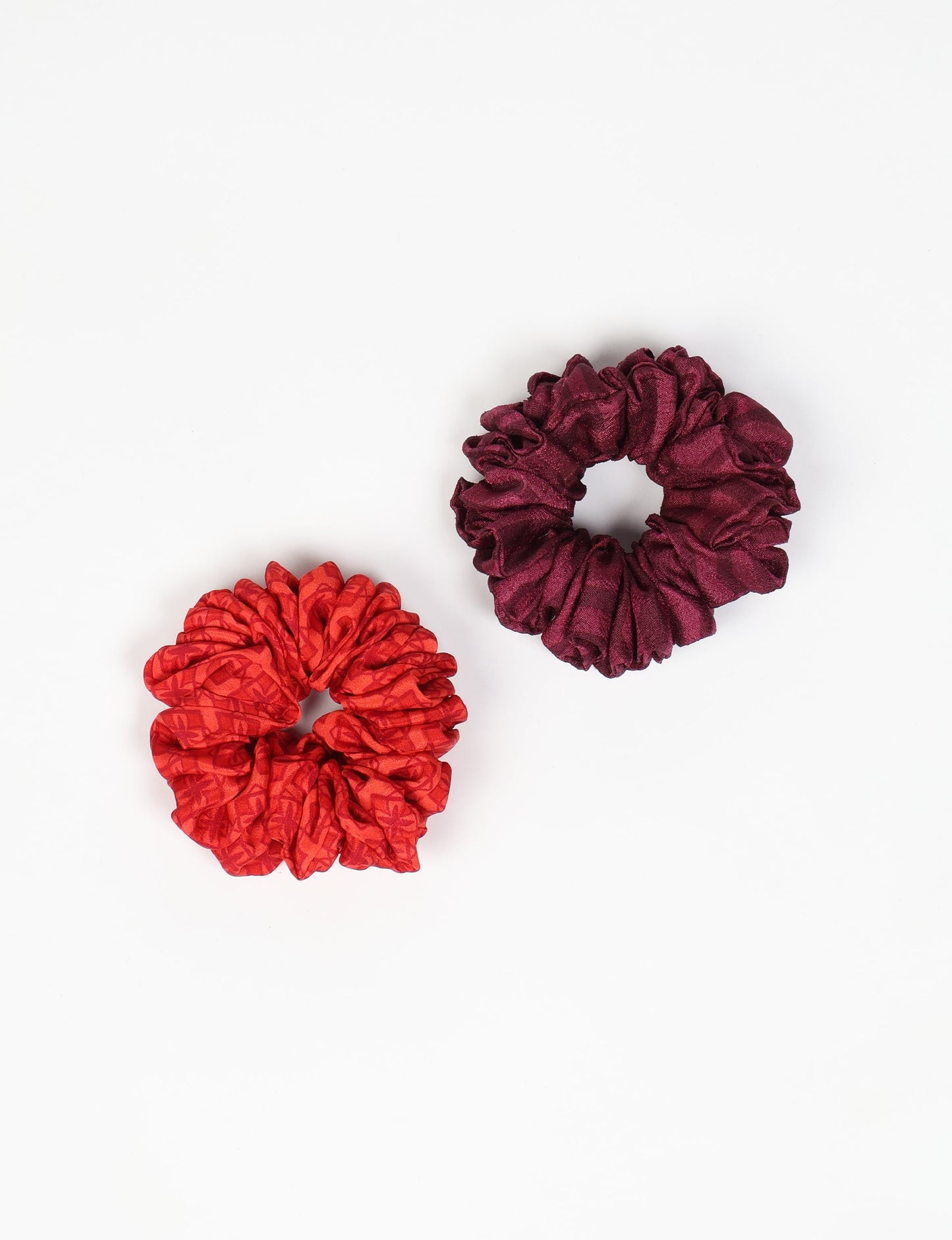 Upgrade your hairstyle with our Scrunchy Set of 2 – elastic hair ties wrapped in colorful Indian sari fabric. A top pick in ethical and green fashion, these eco-friendly prints add flair to your wrist and hair, making a sustainable style statement that catches attention and sparks change.