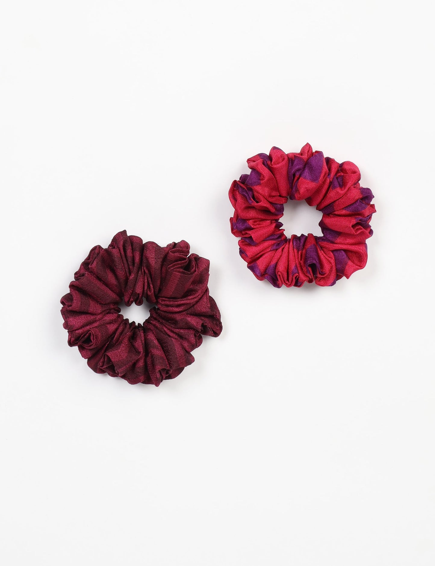 Upgrade your hairstyle with our Scrunchy Set of 2 – elastic hair ties wrapped in colorful Indian sari fabric. A top pick in ethical and green fashion, these eco-friendly prints add flair to your wrist and hair, making a sustainable style statement that catches attention and sparks change.