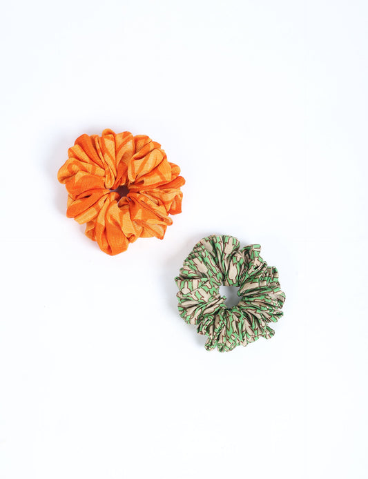 Upgrade your hairstyle with our Scrunchy Set of 2 – elastic hair ties wrapped in colorful Indian sari fabric. A top pick in ethical and green fashion, these eco-friendly prints add flair to your wrist and hair, making a sustainable style statement that catches attention and sparks change.
