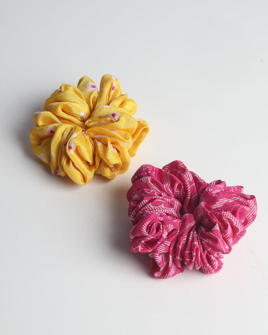 Upgrade your hairstyle with our Scrunchy Set of 2 – elastic hair ties wrapped in colorful Indian sari fabric. A top pick in ethical and green fashion, these eco-friendly prints add flair to your wrist and hair, making a sustainable style statement that catches attention and sparks change.