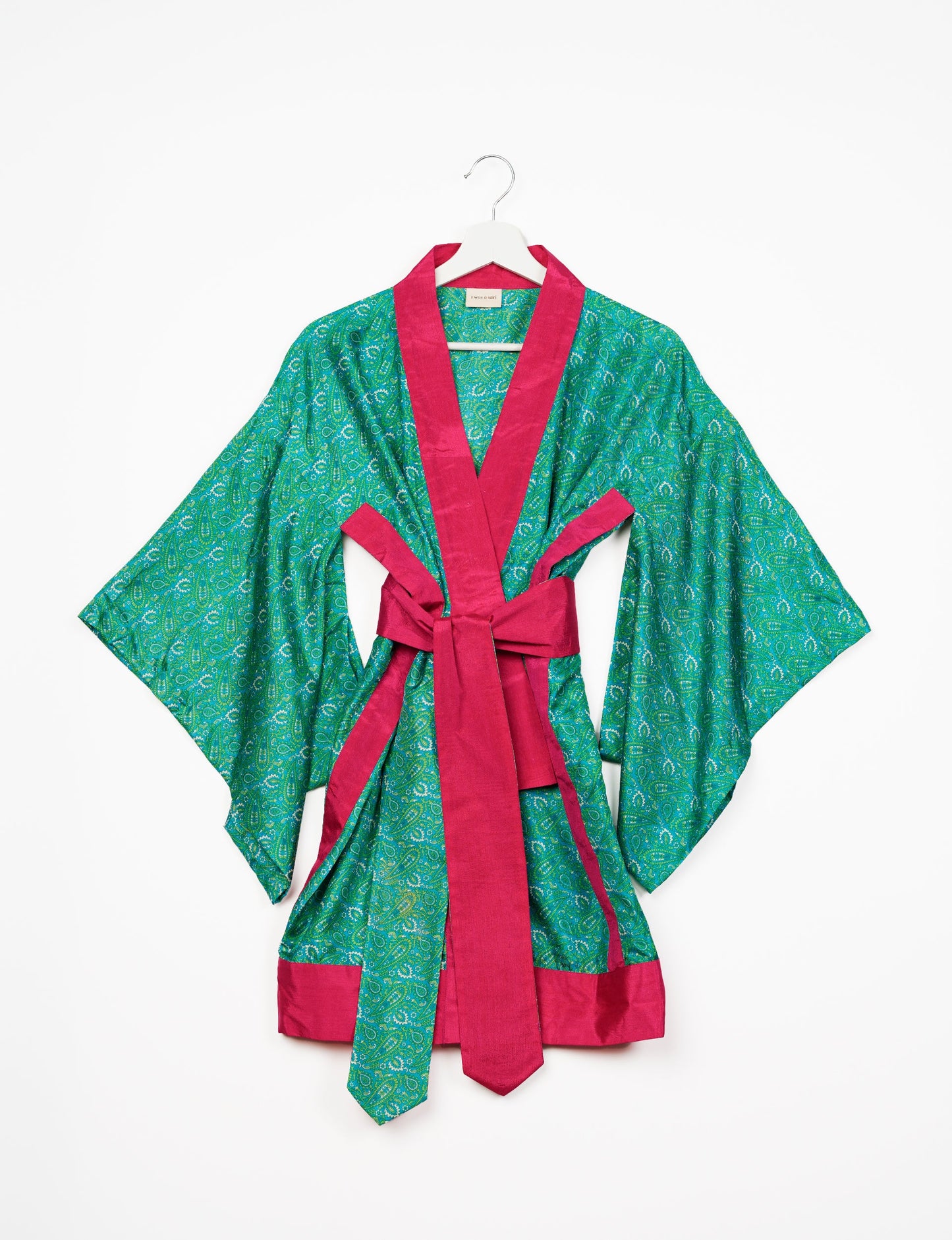 Radiant and sustainably crafted KIMONO with humble beginnings from the streets of India. Versatile and eco-friendly layering piece for casual trousers, swimwear, or our spaghetti strap dress. Embrace conscious fashion and sustainable style with this unique and culturally inspired kimono, sure to invite compliments.