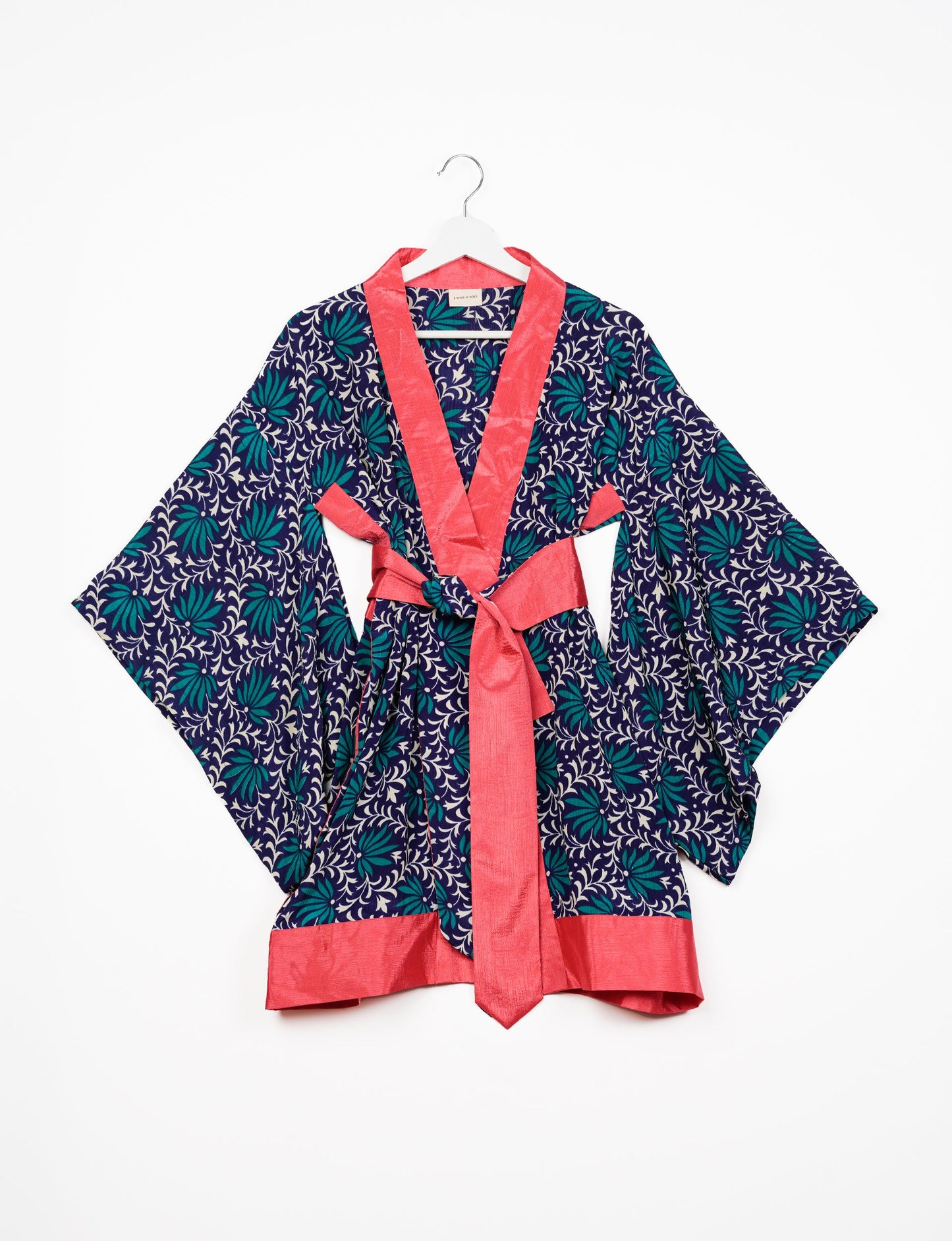 Radiant and sustainably crafted KIMONO with humble beginnings from the streets of India. Versatile and eco-friendly layering piece for casual trousers, swimwear, or our spaghetti strap dress. Embrace conscious fashion and sustainable style with this unique and culturally inspired kimono, sure to invite compliments.