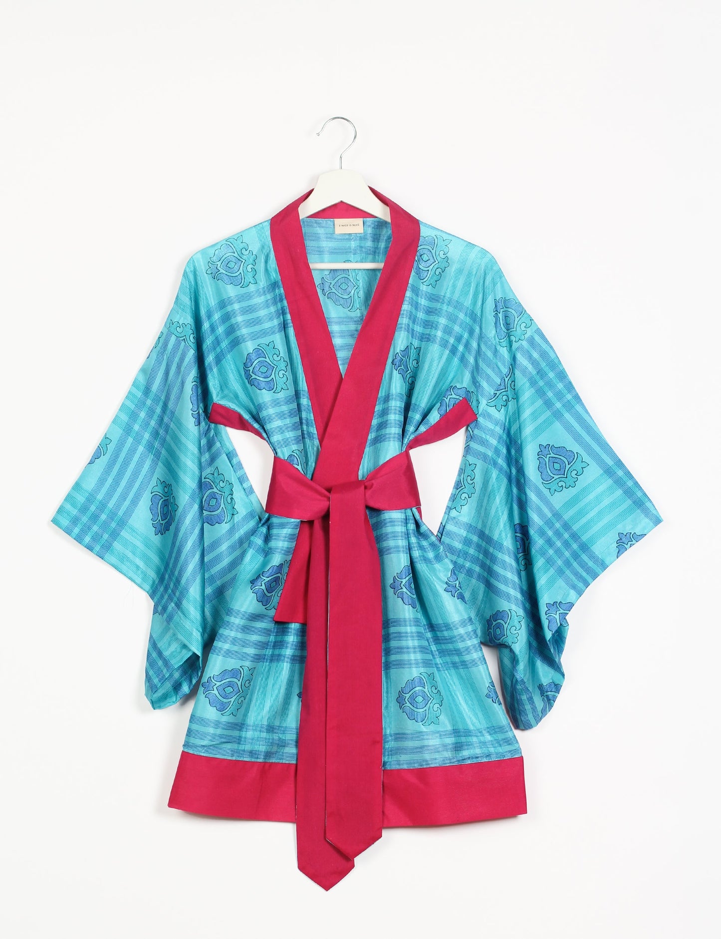 Radiant and sustainably crafted KIMONO with humble beginnings from the streets of India. Versatile and eco-friendly layering piece for casual trousers, swimwear, or our spaghetti strap dress. Embrace conscious fashion and sustainable style with this unique and culturally inspired kimono, sure to invite compliments.