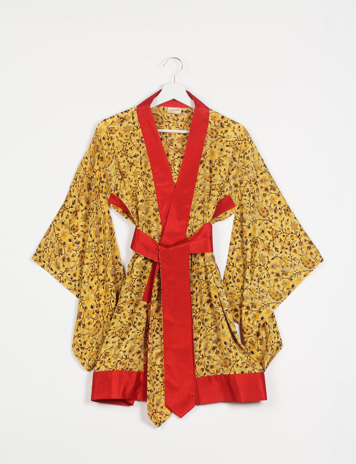 Radiant and sustainably crafted KIMONO with humble beginnings from the streets of India. Versatile and eco-friendly layering piece for casual trousers, swimwear, or our spaghetti strap dress. Embrace conscious fashion and sustainable style with this unique and culturally inspired kimono, sure to invite compliments.