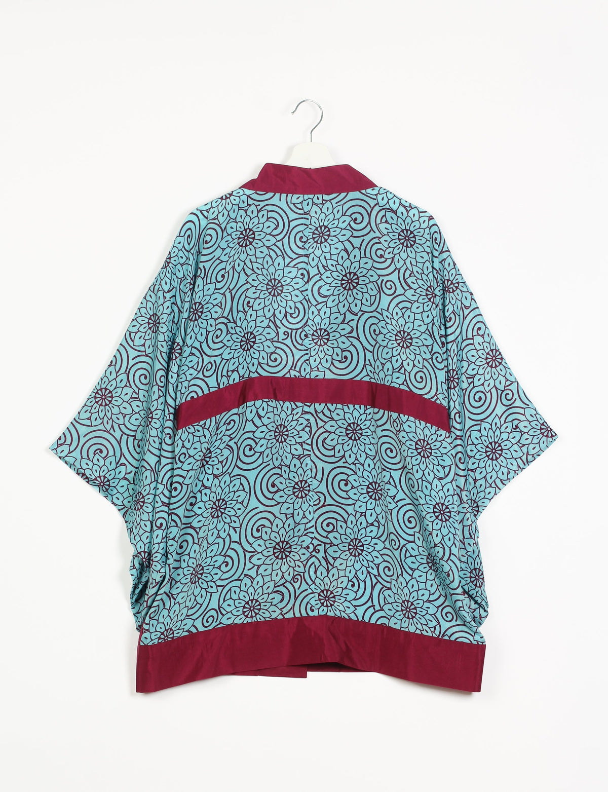 Radiant and sustainably crafted KIMONO with humble beginnings from the streets of India. Versatile and eco-friendly layering piece for casual trousers, swimwear, or our spaghetti strap dress. Embrace conscious fashion and sustainable style with this unique and culturally inspired kimono, sure to invite compliments.