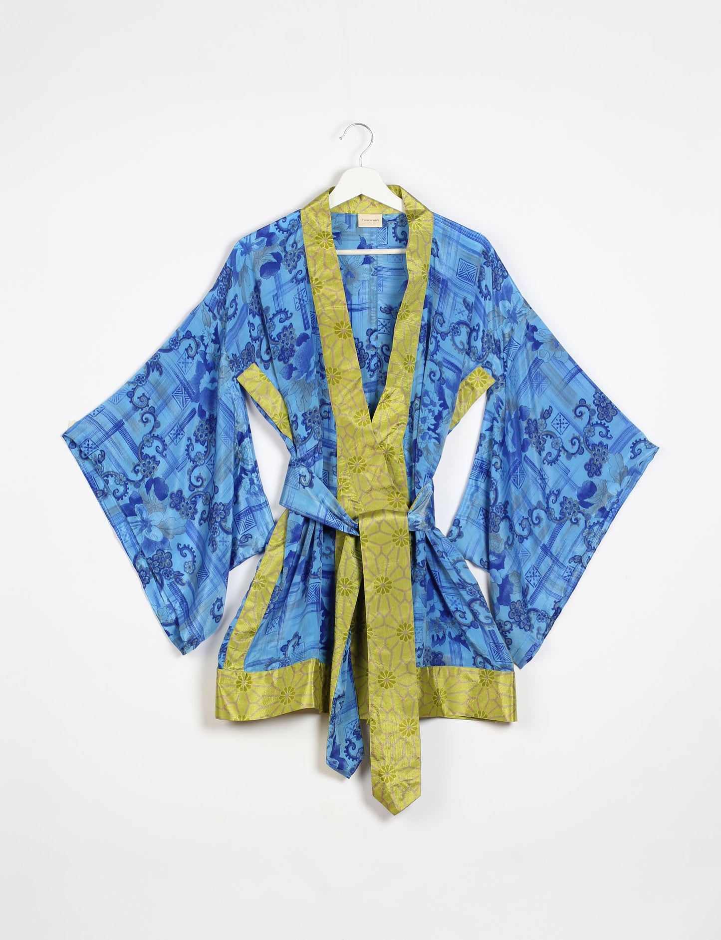 Radiant and sustainably crafted KIMONO with humble beginnings from the streets of India. Versatile and eco-friendly layering piece for casual trousers, swimwear, or our spaghetti strap dress. Embrace conscious fashion and sustainable style with this unique and culturally inspired kimono, sure to invite compliments.