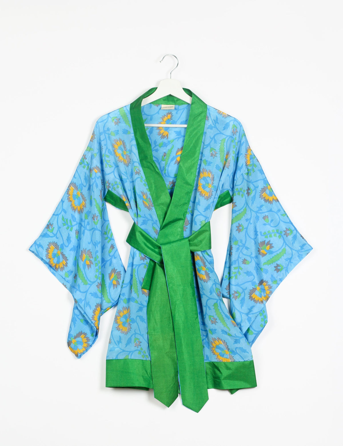 Radiant and sustainably crafted KIMONO with humble beginnings from the streets of India. Versatile and eco-friendly layering piece for casual trousers, swimwear, or our spaghetti strap dress. Embrace conscious fashion and sustainable style with this unique and culturally inspired kimono, sure to invite compliments.