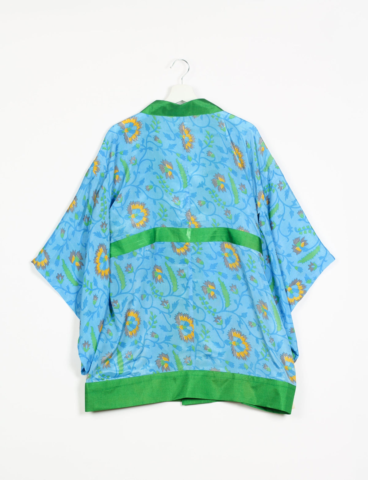 Radiant and sustainably crafted KIMONO with humble beginnings from the streets of India. Versatile and eco-friendly layering piece for casual trousers, swimwear, or our spaghetti strap dress. Embrace conscious fashion and sustainable style with this unique and culturally inspired kimono, sure to invite compliments.