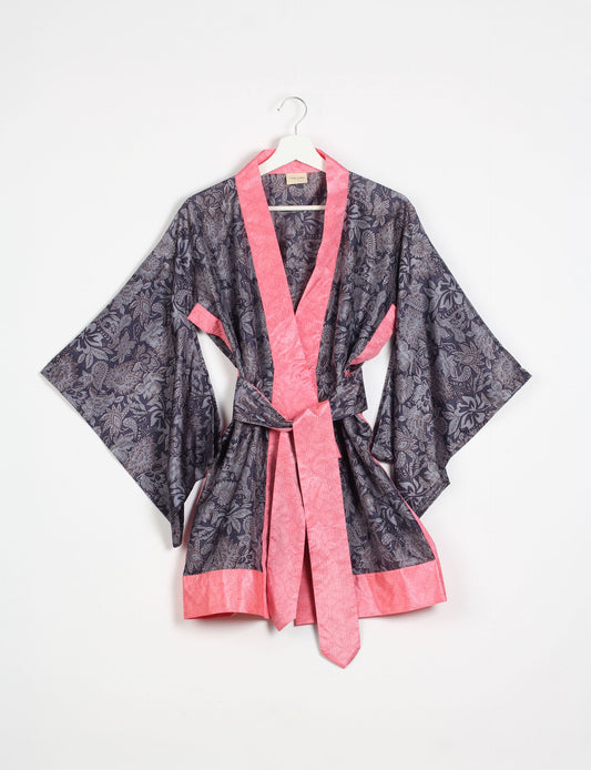 Radiant and sustainably crafted KIMONO with humble beginnings from the streets of India. Versatile and eco-friendly layering piece for casual trousers, swimwear, or our spaghetti strap dress. Embrace conscious fashion and sustainable style with this unique and culturally inspired kimono, sure to invite compliments.