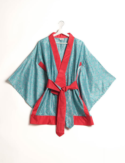 Radiant and sustainably crafted KIMONO with humble beginnings from the streets of India. Versatile and eco-friendly layering piece for casual trousers, swimwear, or our spaghetti strap dress. Embrace conscious fashion and sustainable style with this unique and culturally inspired kimono, sure to invite compliments.