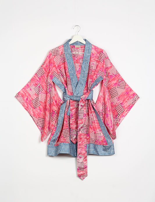 Radiant and sustainably crafted KIMONO with humble beginnings from the streets of India. Versatile and eco-friendly layering piece for casual trousers, swimwear, or our spaghetti strap dress. Embrace conscious fashion and sustainable style with this unique and culturally inspired kimono, sure to invite compliments.