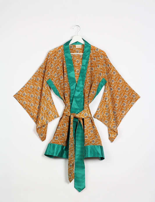 Radiant and sustainably crafted KIMONO with humble beginnings from the streets of India. Versatile and eco-friendly layering piece for casual trousers, swimwear, or our spaghetti strap dress. Embrace conscious fashion and sustainable style with this unique and culturally inspired kimono, sure to invite compliments.