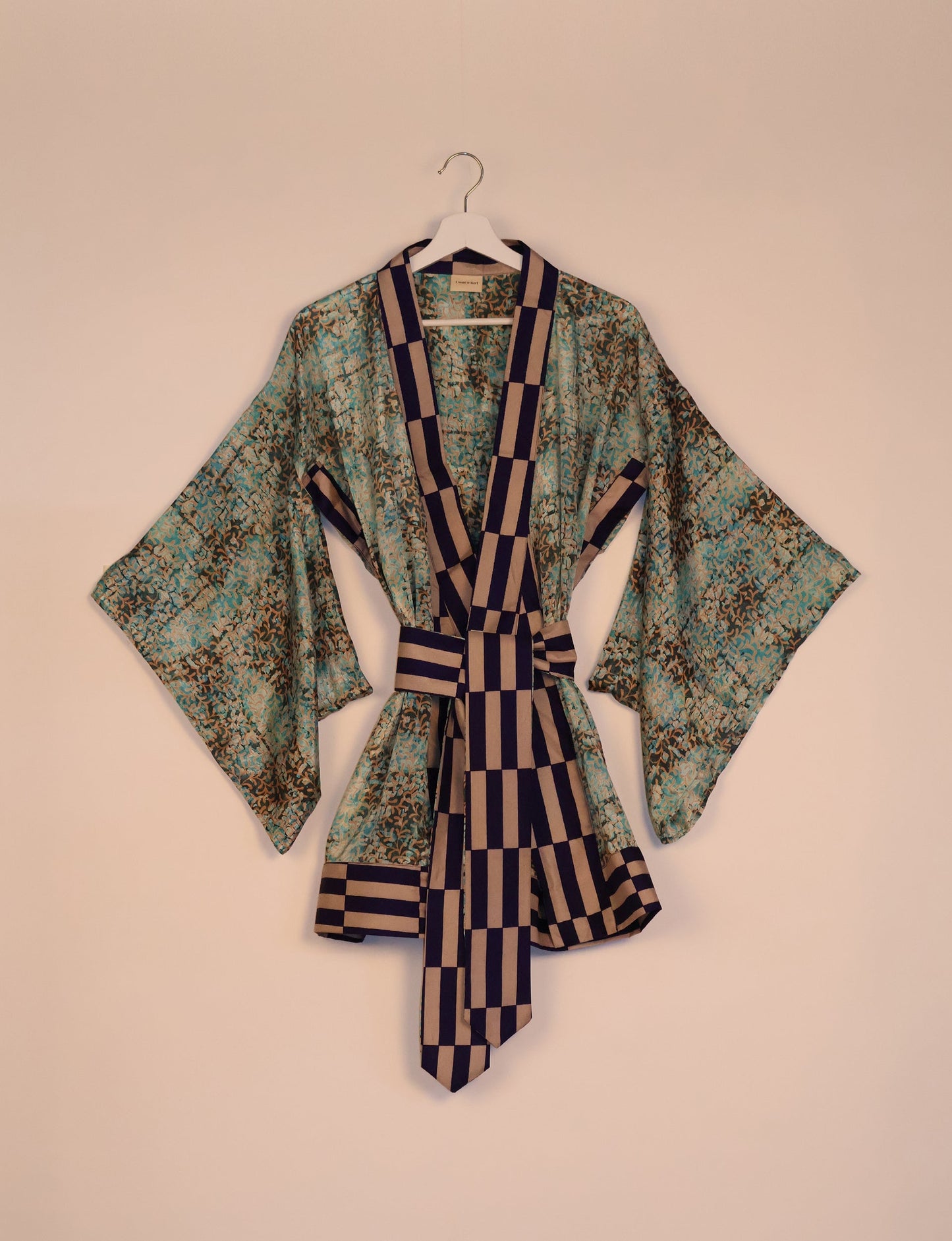 Radiant and sustainably crafted KIMONO with humble beginnings from the streets of India. Versatile and eco-friendly layering piece for casual trousers, swimwear, or our spaghetti strap dress. Embrace conscious fashion and sustainable style with this unique and culturally inspired kimono, sure to invite compliments.