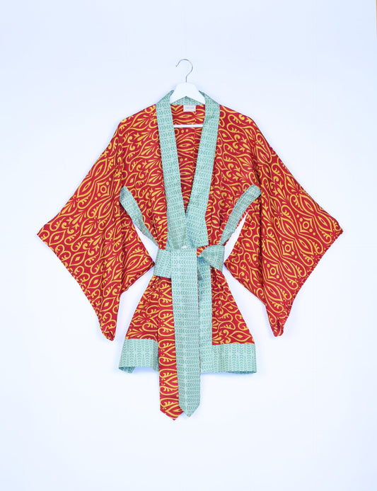 Radiant and sustainably crafted KIMONO with humble beginnings from the streets of India. Versatile and eco-friendly layering piece for casual trousers, swimwear, or our spaghetti strap dress. Embrace conscious fashion and sustainable style with this unique and culturally inspired kimono, sure to invite compliments.