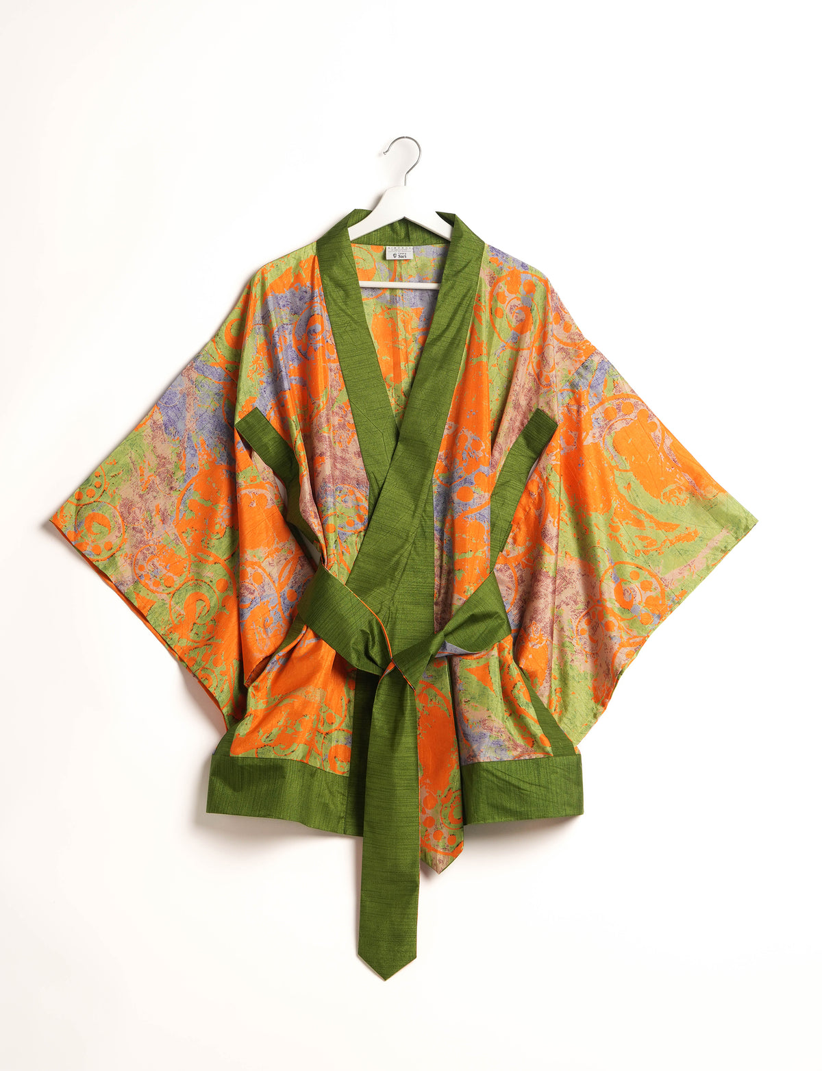 Radiant and sustainably crafted KIMONO with humble beginnings from the streets of India. Versatile and eco-friendly layering piece for casual trousers, swimwear, or our spaghetti strap dress. Embrace conscious fashion and sustainable style with this unique and culturally inspired kimono, sure to invite compliments.