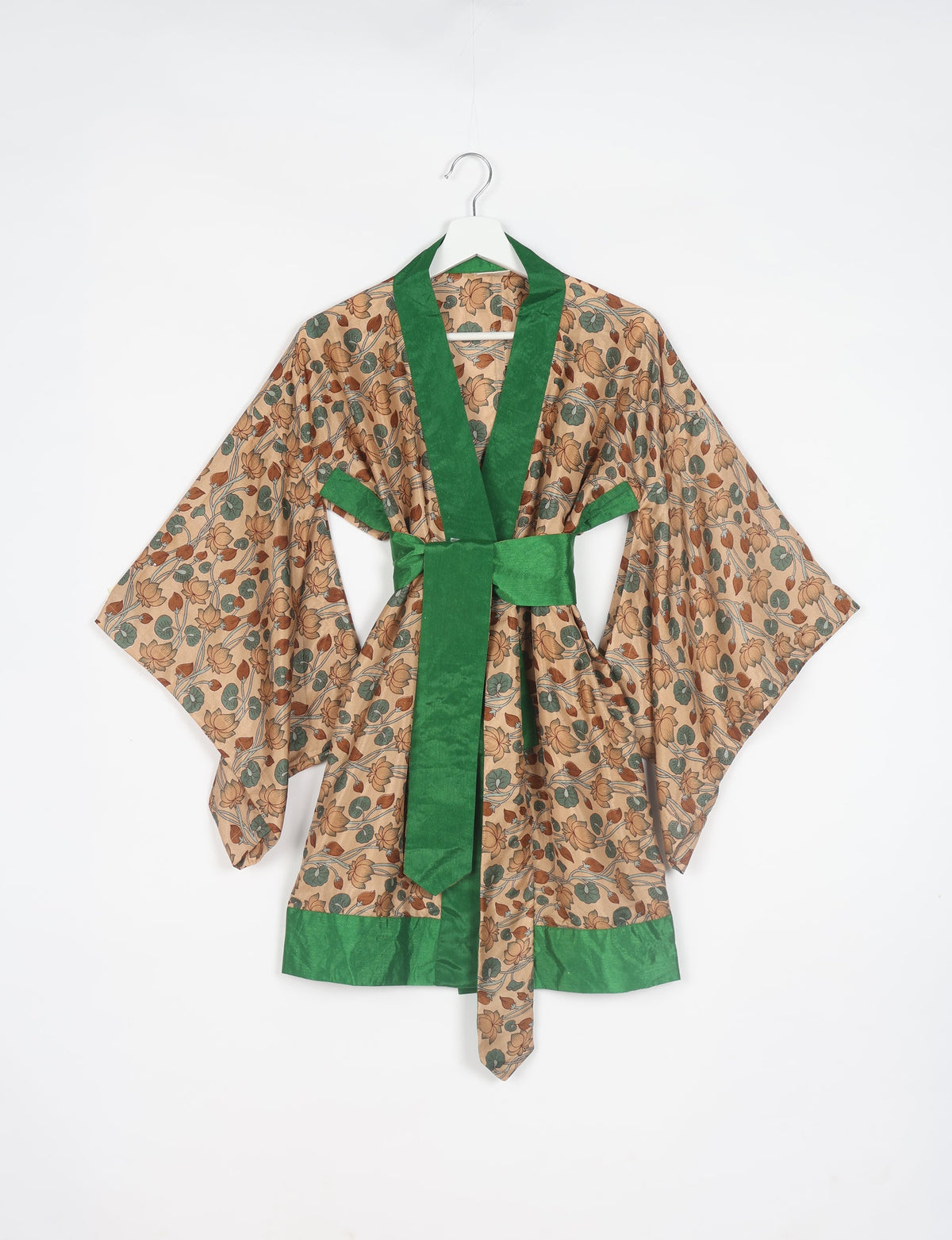 Radiant and sustainably crafted KIMONO with humble beginnings from the streets of India. Versatile and eco-friendly layering piece for casual trousers, swimwear, or our spaghetti strap dress. Embrace conscious fashion and sustainable style with this unique and culturally inspired kimono, sure to invite compliments.