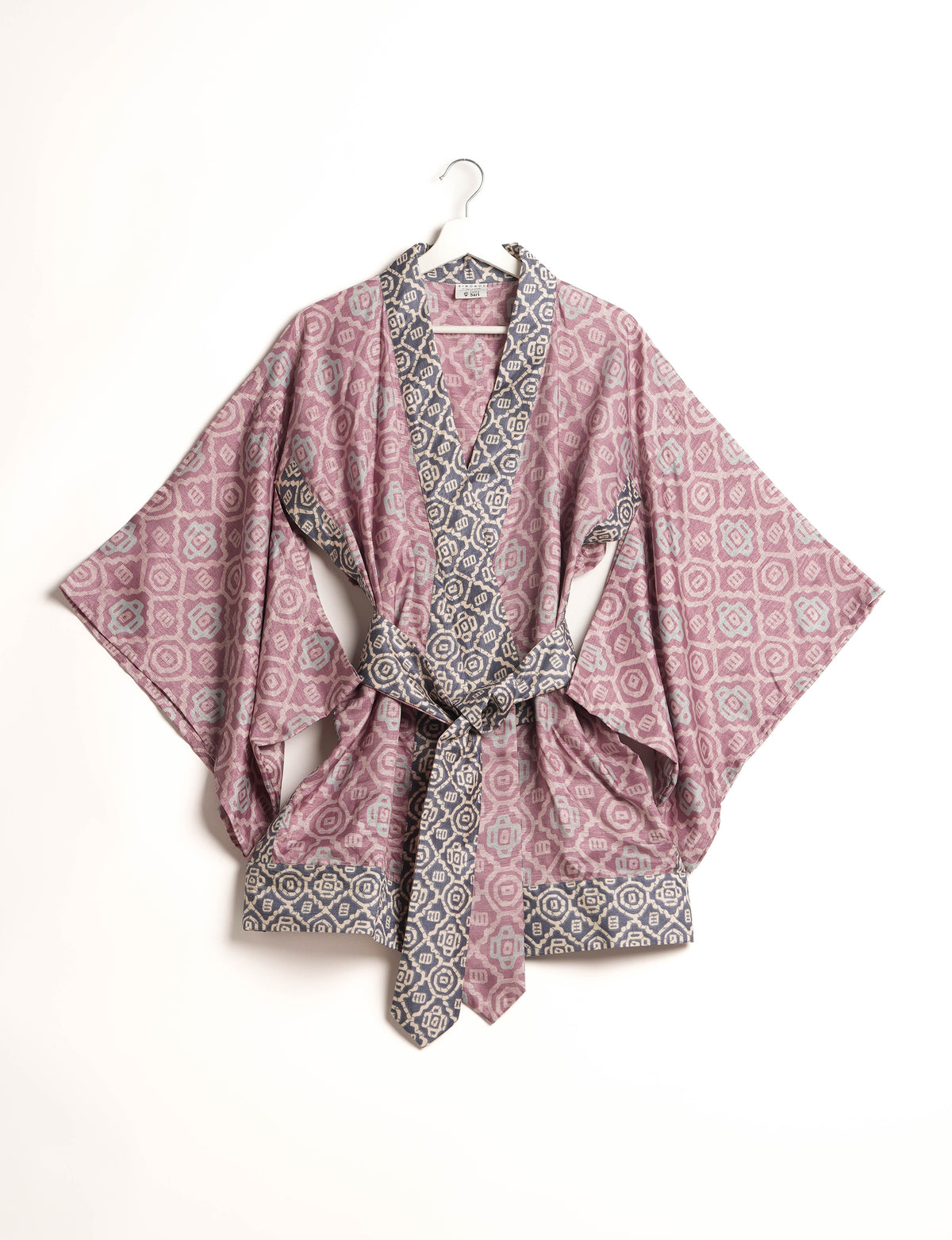 Radiant and sustainably crafted KIMONO with humble beginnings from the streets of India. Versatile and eco-friendly layering piece for casual trousers, swimwear, or our spaghetti strap dress. Embrace conscious fashion and sustainable style with this unique and culturally inspired kimono, sure to invite compliments.