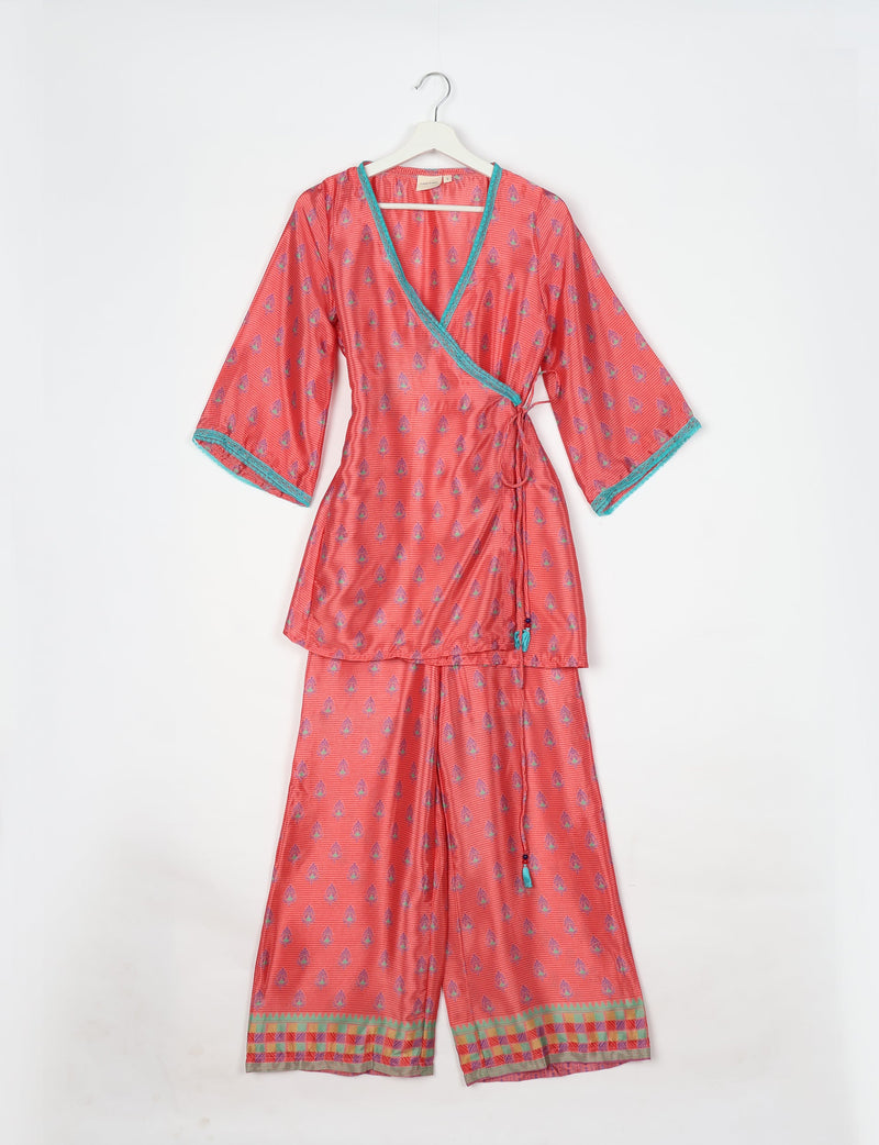 Pink tunic set with micro leaf pattern, turquoise trim on neckline and sleeves, and matching wide-leg pants with border print