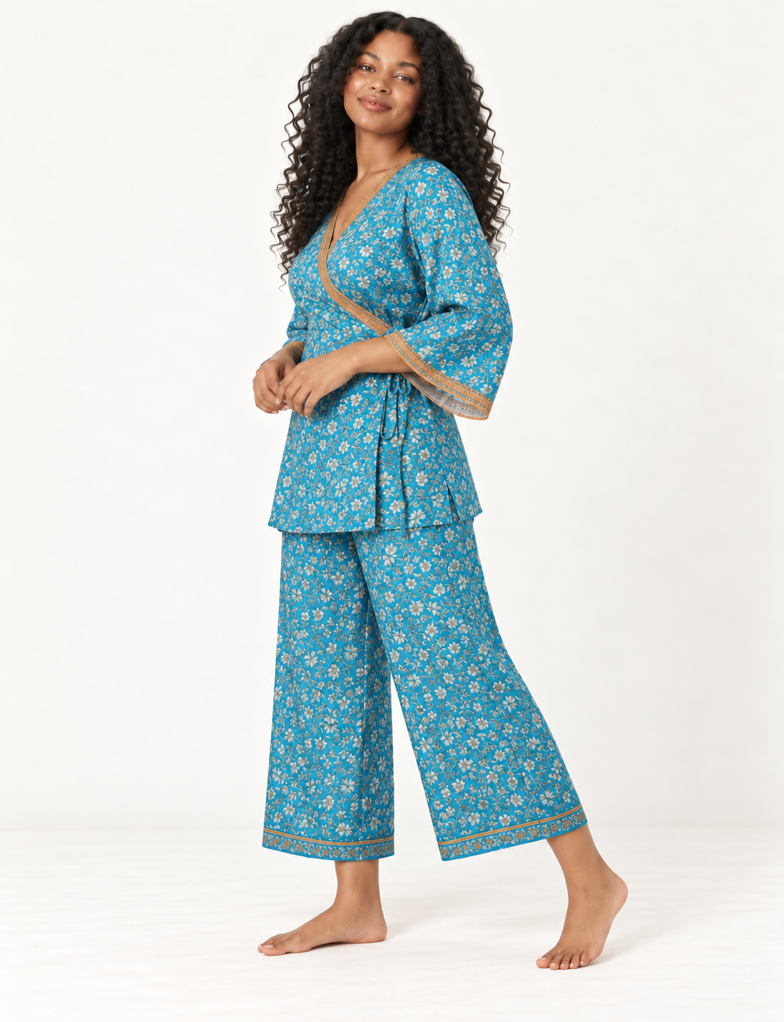 Pink tunic set with micro leaf pattern, turquoise trim on neckline and sleeves, and matching wide-leg pants with border print