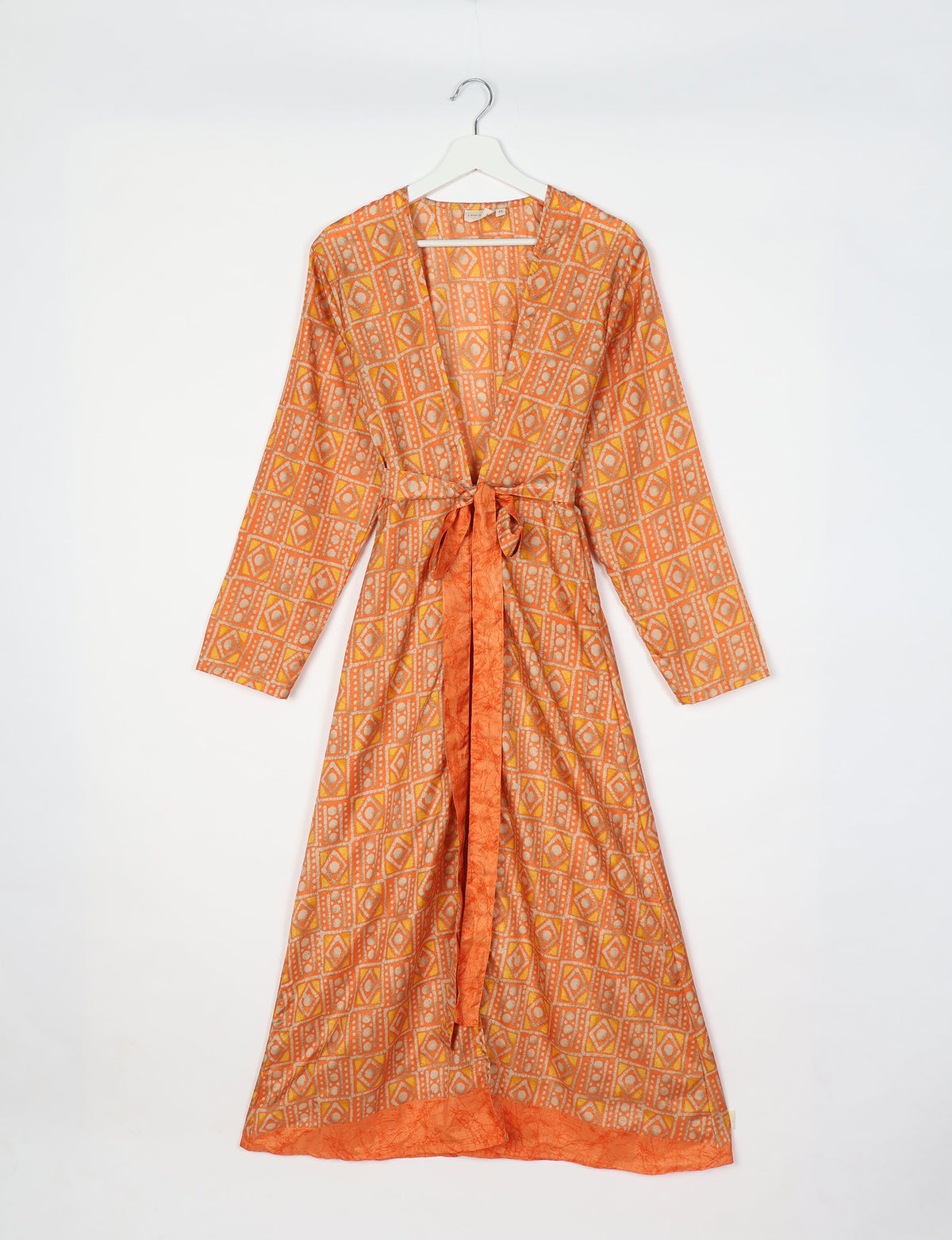 Long-sleeve beach robe with yellow and orange geometric pattern, front tie belt, and solid orange trim, hanging on white hanger