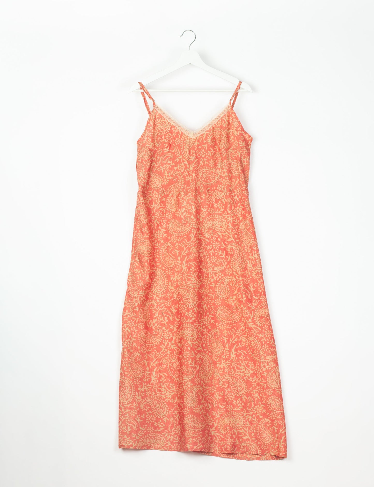 Spaghetti strap dress made from sustainable materials, embodying ethical fashion principles. Ideal for eco-friendly travelers seeking laid-back style.