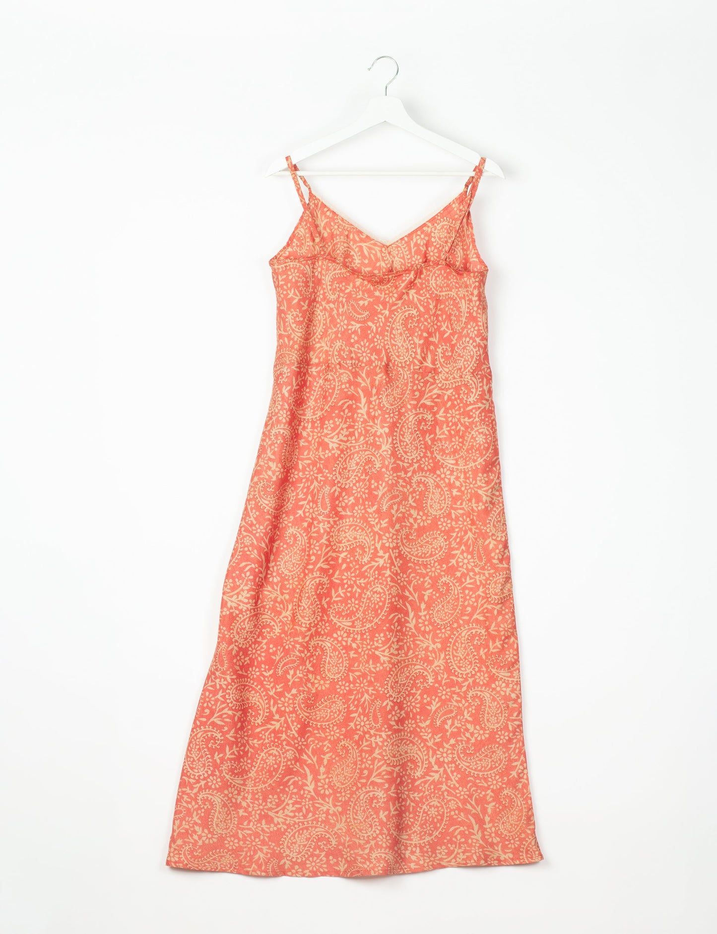 Spaghetti strap dress made from sustainable materials, embodying ethical fashion principles. Ideal for eco-friendly travelers seeking laid-back style.