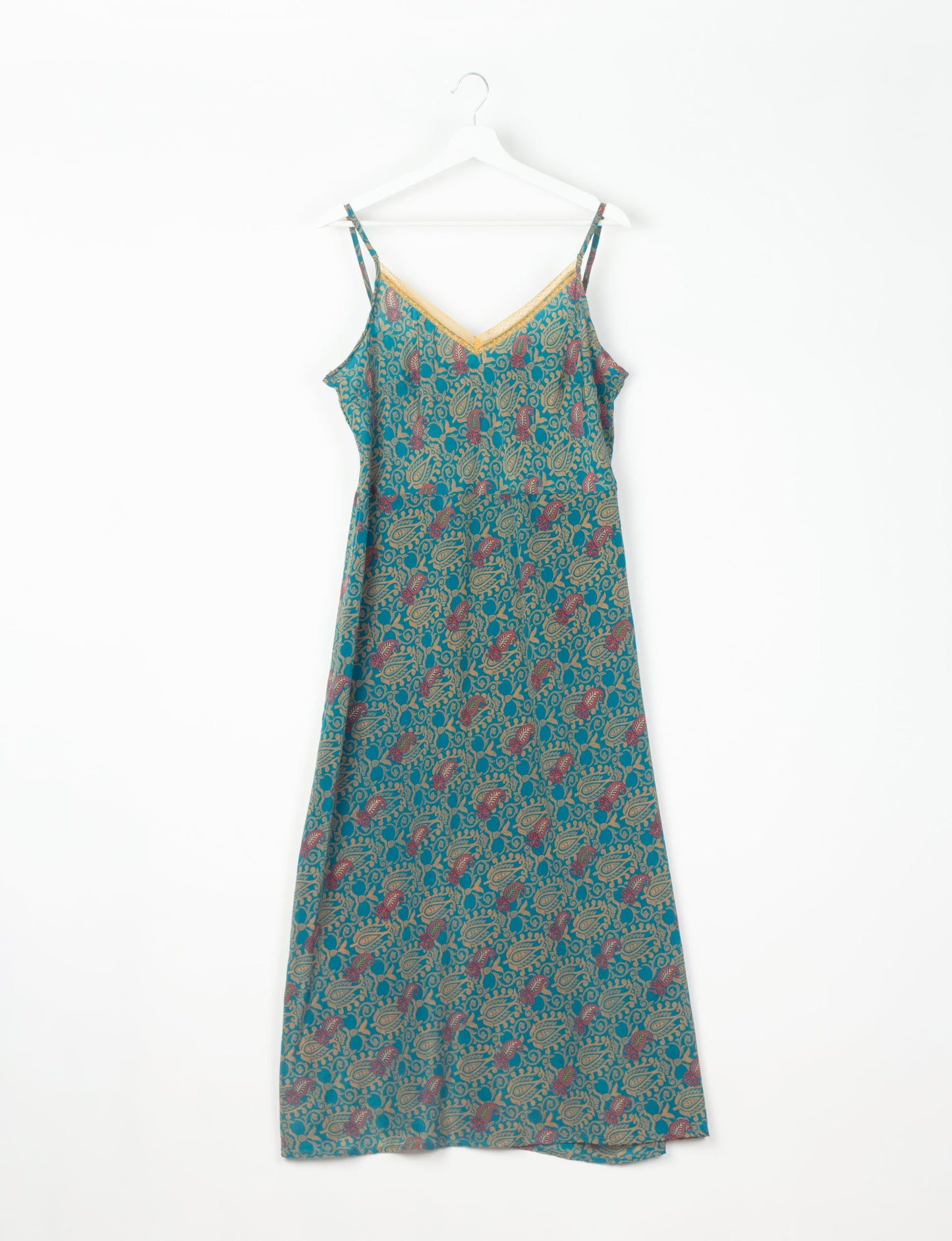 Spaghetti strap dress made from sustainable materials, embodying ethical fashion principles. Ideal for eco-friendly travelers seeking laid-back style.