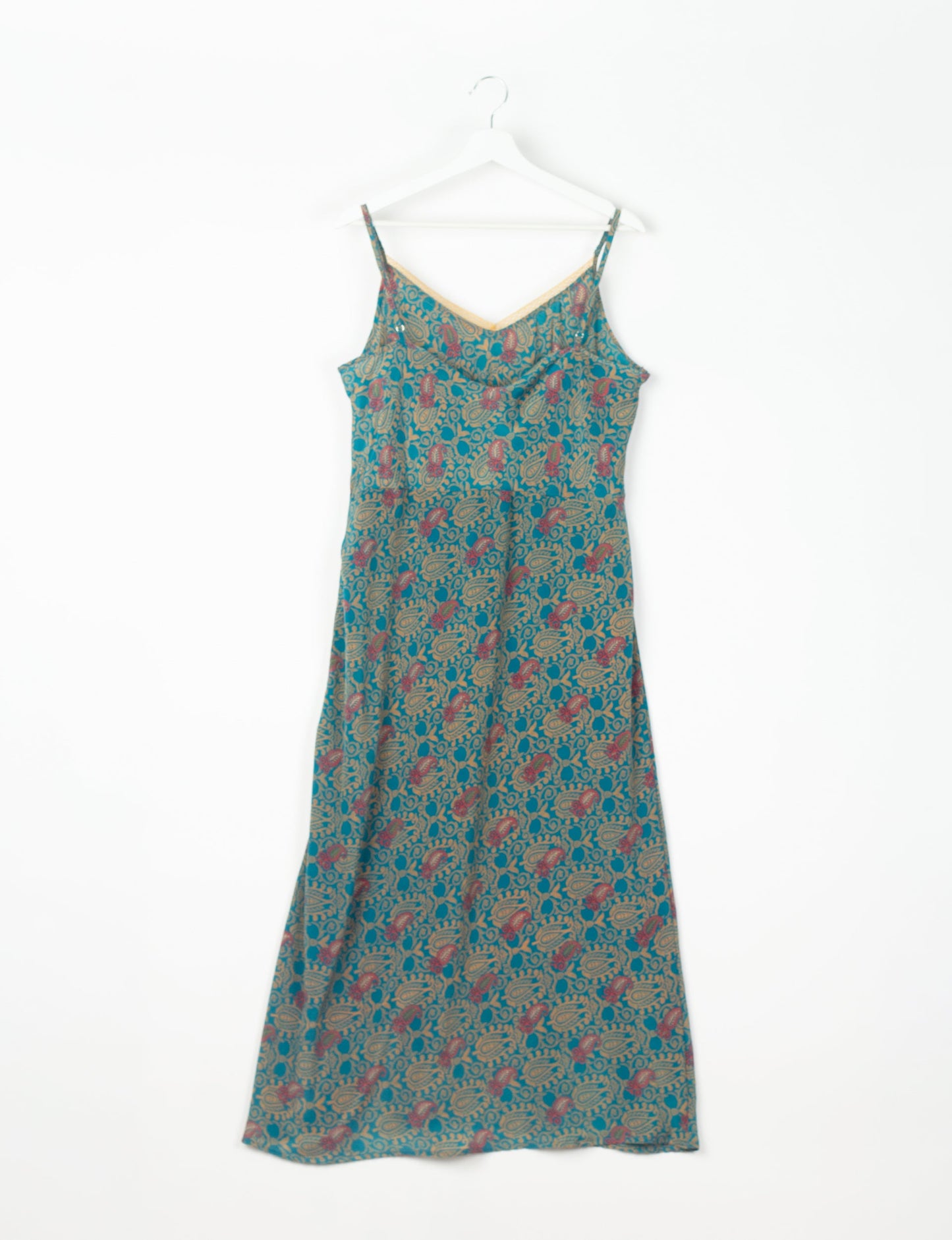 Spaghetti strap dress made from sustainable materials, embodying ethical fashion principles. Ideal for eco-friendly travelers seeking laid-back style.