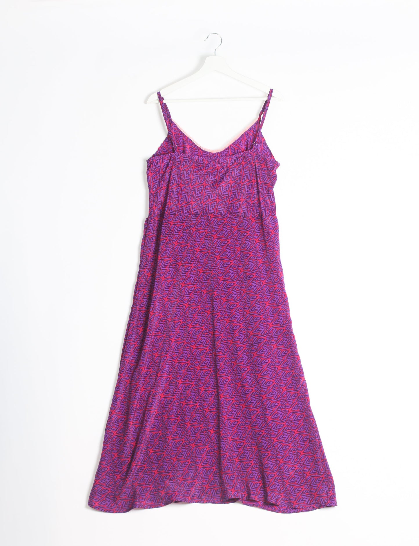 Spaghetti strap dress made from sustainable materials, embodying ethical fashion principles. Ideal for eco-friendly travelers seeking laid-back style.