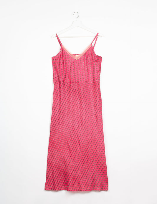 Spaghetti strap dress made from sustainable materials, embodying ethical fashion principles. Ideal for eco-friendly travelers seeking laid-back style.