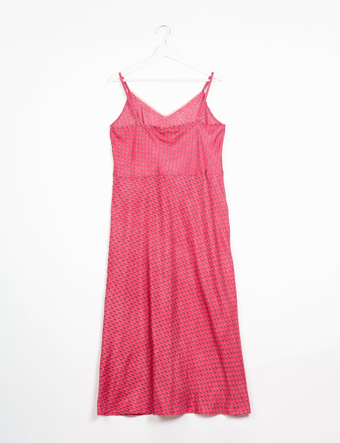 Spaghetti strap dress made from sustainable materials, embodying ethical fashion principles. Ideal for eco-friendly travelers seeking laid-back style.