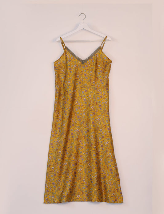 Spaghetti strap dress made from sustainable materials, embodying ethical fashion principles. Ideal for eco-friendly travelers seeking laid-back style.