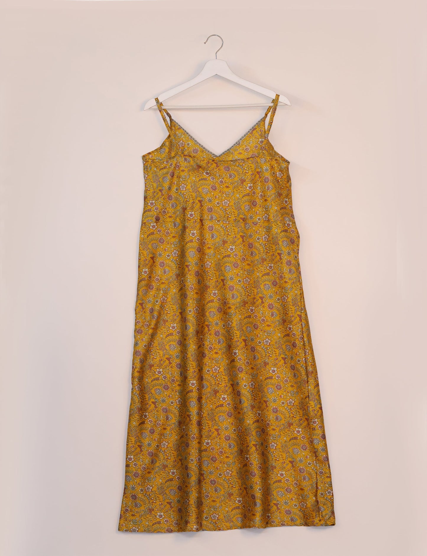 Spaghetti strap dress made from sustainable materials, embodying ethical fashion principles. Ideal for eco-friendly travelers seeking laid-back style.