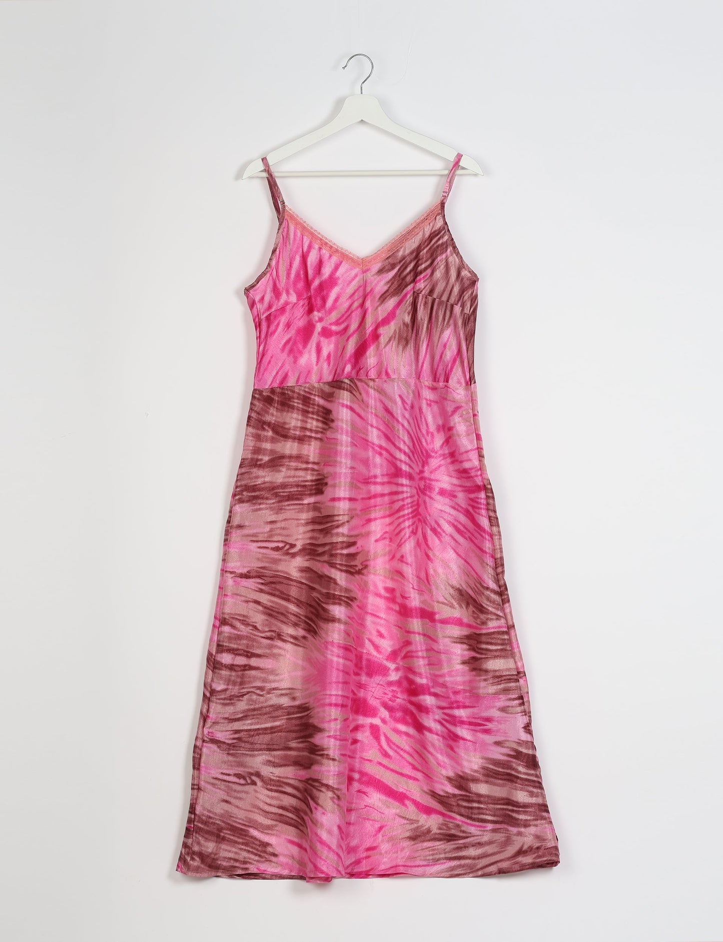 Spaghetti strap dress made from sustainable materials, embodying ethical fashion principles. Ideal for eco-friendly travelers seeking laid-back style.