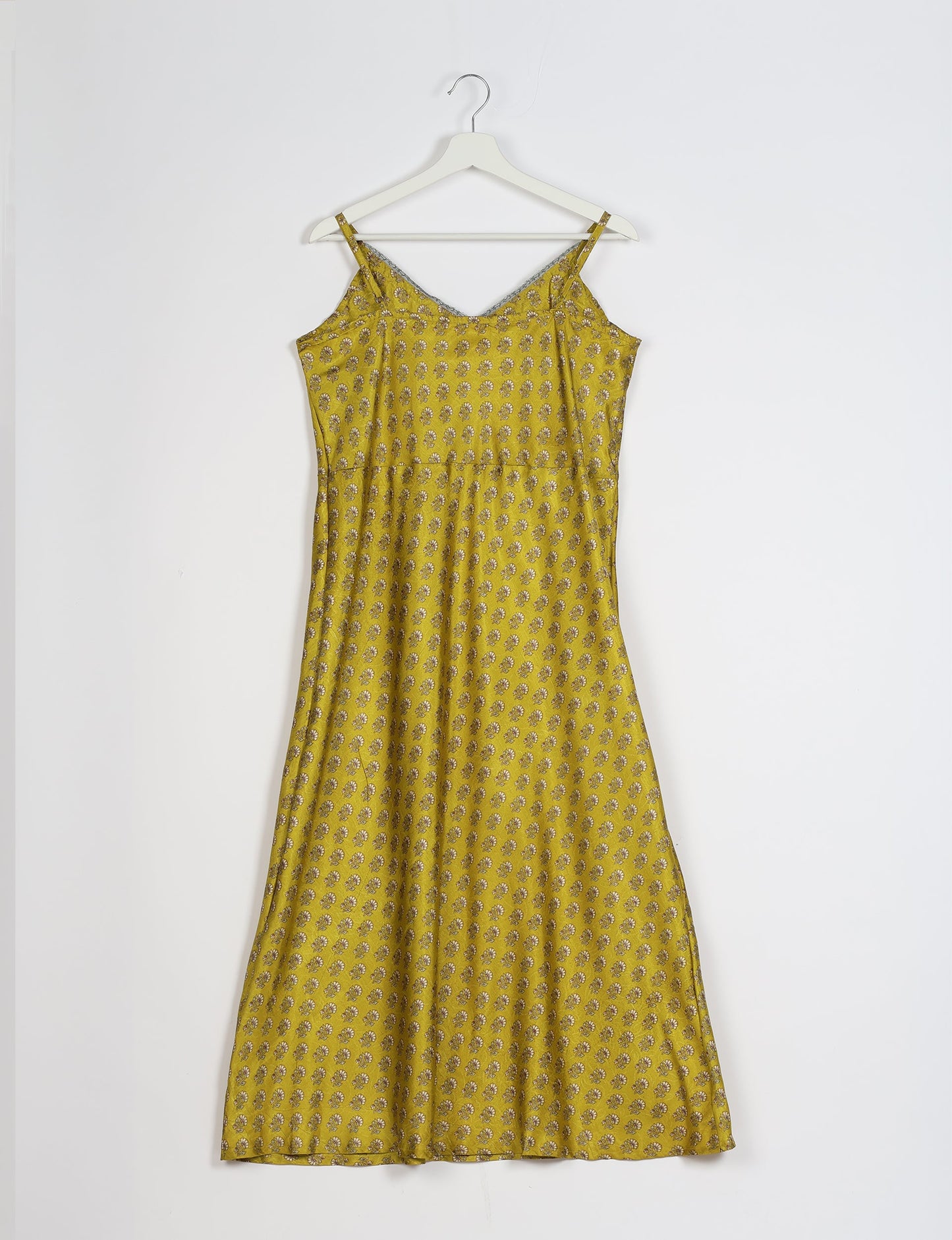 Spaghetti strap dress made from sustainable materials, embodying ethical fashion principles. Ideal for eco-friendly travelers seeking laid-back style.