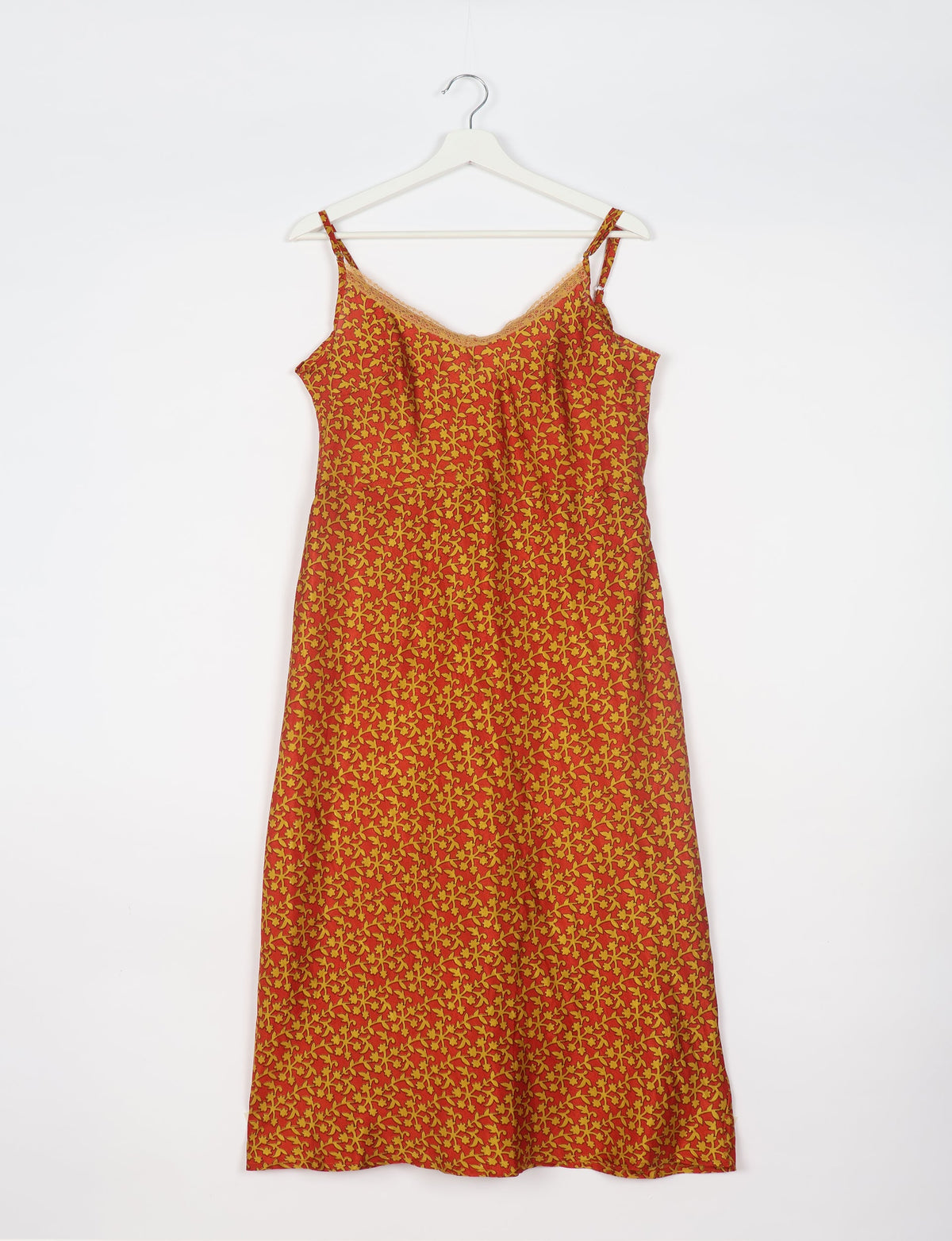 Spaghetti strap dress made from sustainable materials, embodying ethical fashion principles. Ideal for eco-friendly travelers seeking laid-back style.
