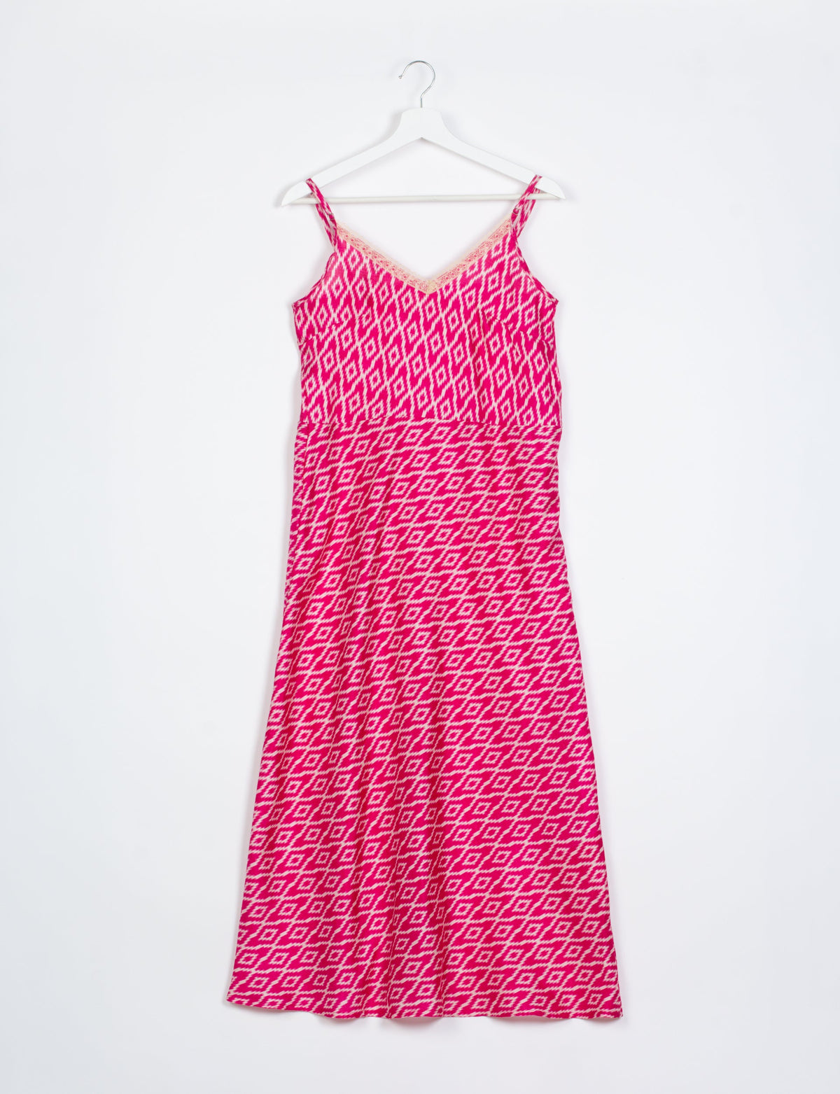 Spaghetti strap dress made from sustainable materials, embodying ethical fashion principles. Ideal for eco-friendly travelers seeking laid-back style.