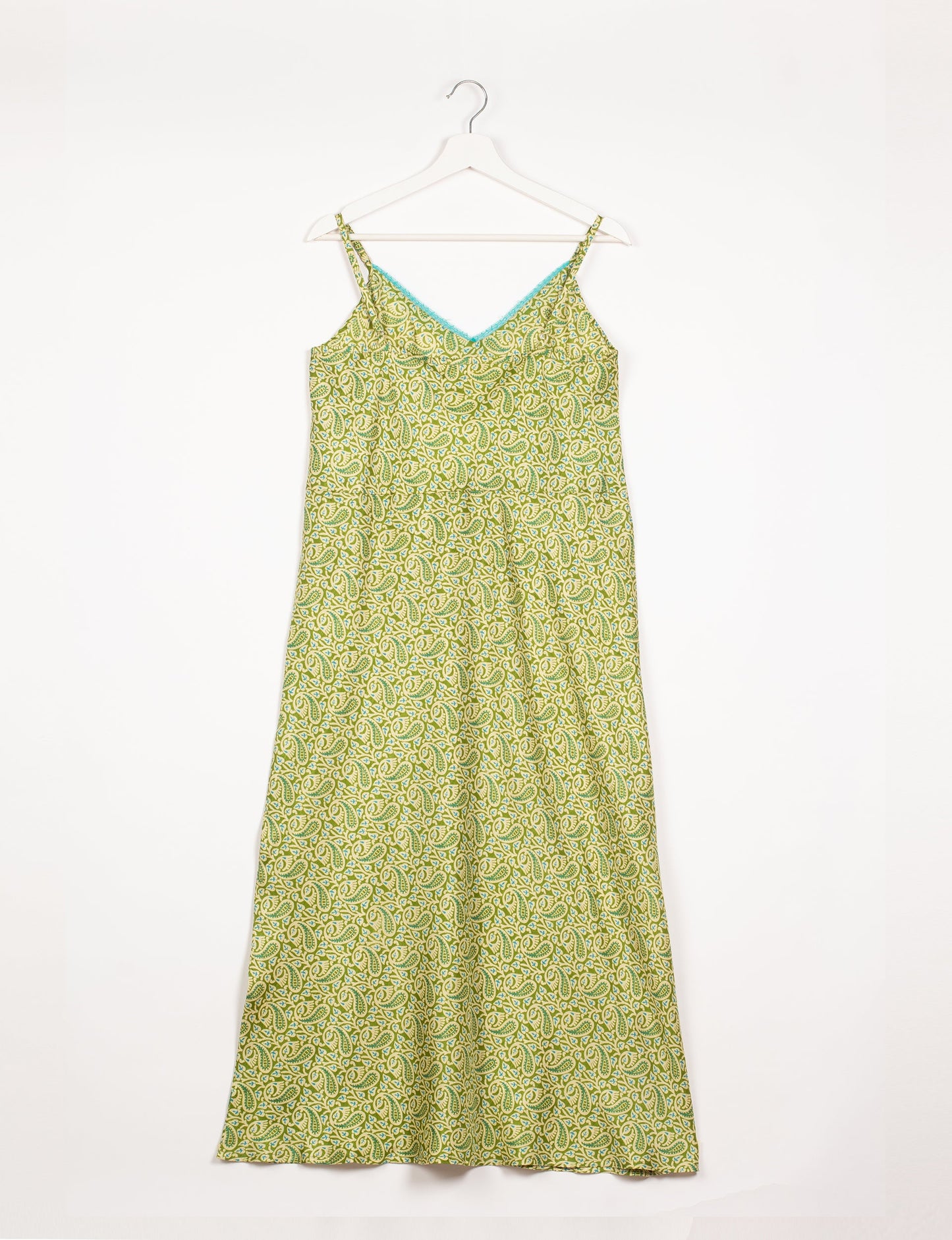 Spaghetti strap dress made from sustainable materials, embodying ethical fashion principles. Ideal for eco-friendly travelers seeking laid-back style.