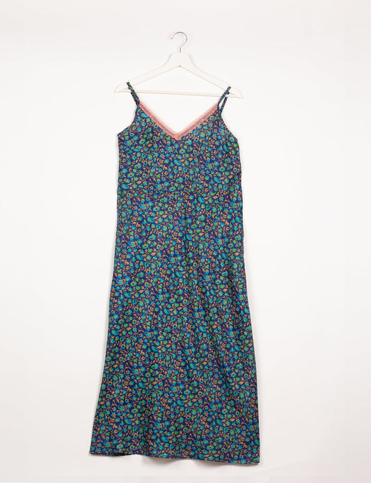 Spaghetti strap dress made from sustainable materials, embodying ethical fashion principles. Ideal for eco-friendly travelers seeking laid-back style.